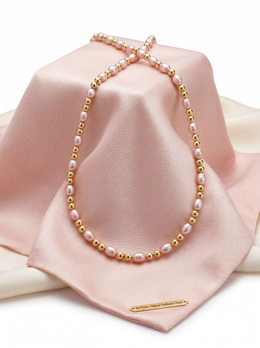 KRE PRIME Women's necklace with natural freshwater pearls and 14K gold beads. Features white/pink pearls and gold accents.