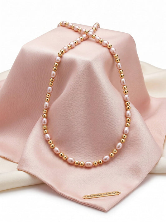 KRE PRIME Women's necklace with natural freshwater pearls and 14K gold beads. Features white/pink pearls and gold accents.