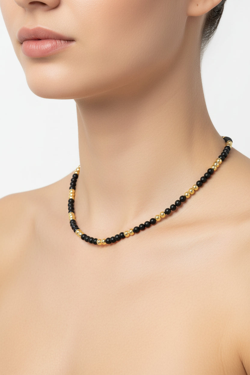 KRE PRIME women's gold-plated necklace with black beads, featuring a luxurious opulence design for elegant style.