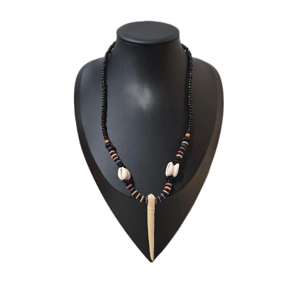 Unisex tribal-inspired beaded pendant necklace by KRE PRIME featuring handcrafted West African beadwork and natural materials.