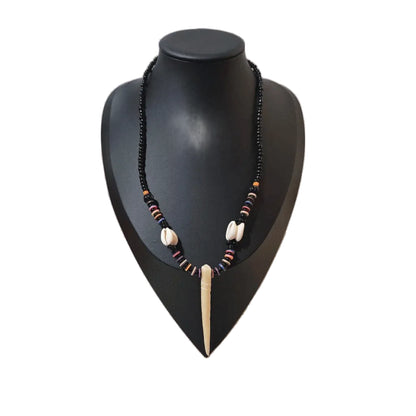 Unisex tribal-inspired beaded pendant necklace by KRE PRIME featuring handcrafted West African beadwork and natural materials.