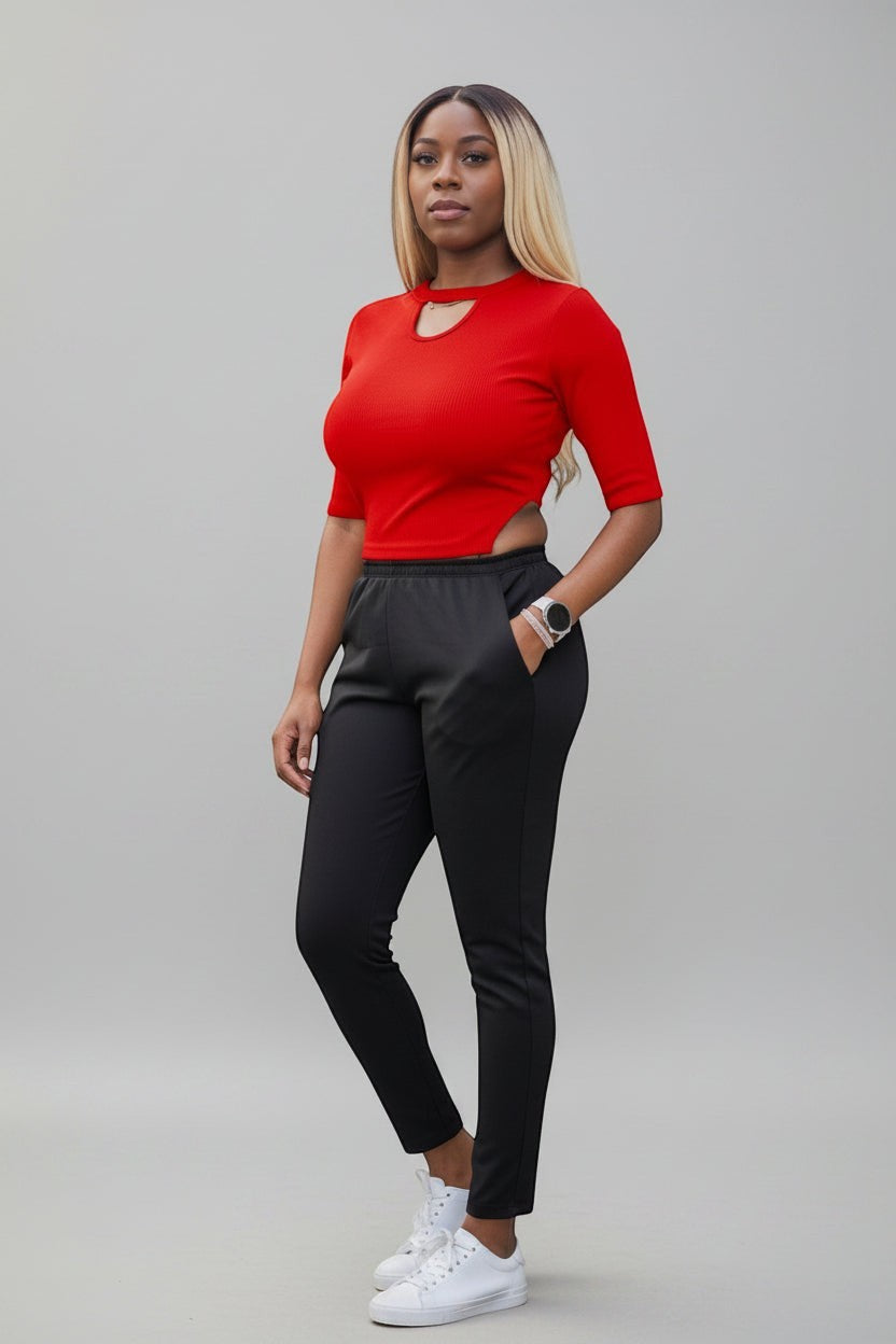 KRE Prime black convertible jumpsuit with cutouts and two interchangeable tops, made of stretch fabric.
