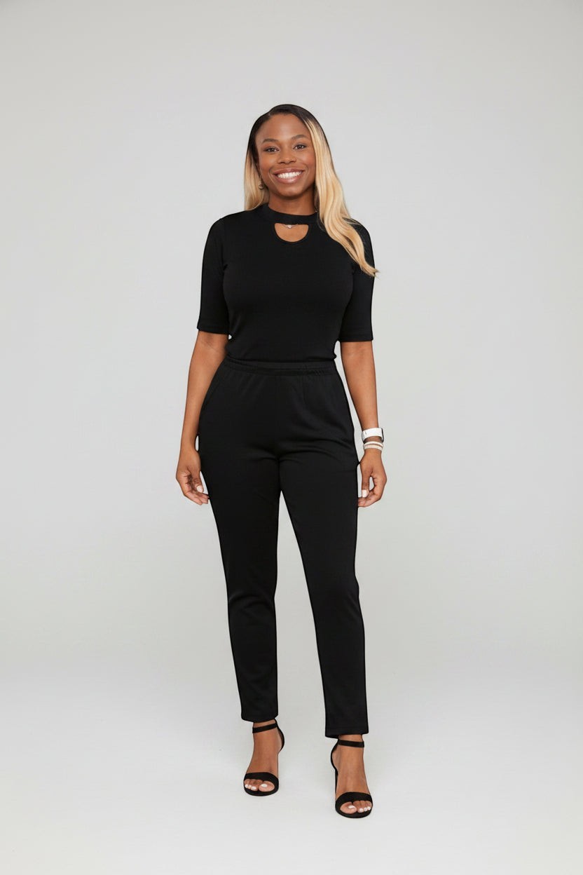 KRE Prime women's convertible jumpsuit with keyhole neckline and black side stripe detail. Stretch polyester blend.