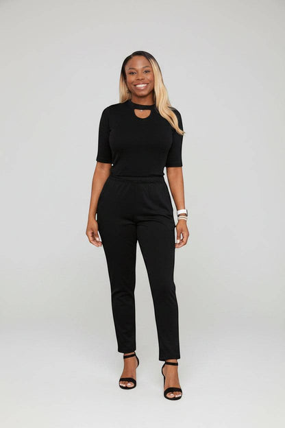 KRE Prime women's black dual-top convertible jumpsuit displayed on a model, showcasing its versatile design and stylish fit.