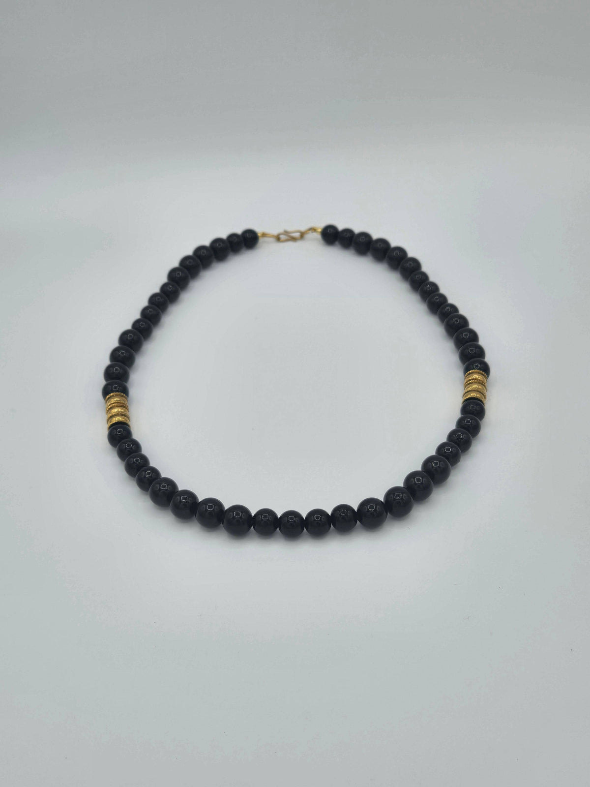 KRE Prime Men 18-inch Eclipse Bead Necklace featuring black beads and a silver clasp on a neutral background.