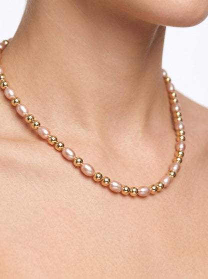KRE PRIME women's necklace with natural freshwater pearls and 14K gold-filled beads. Features light pink rice-shaped pearls and gold spacers.