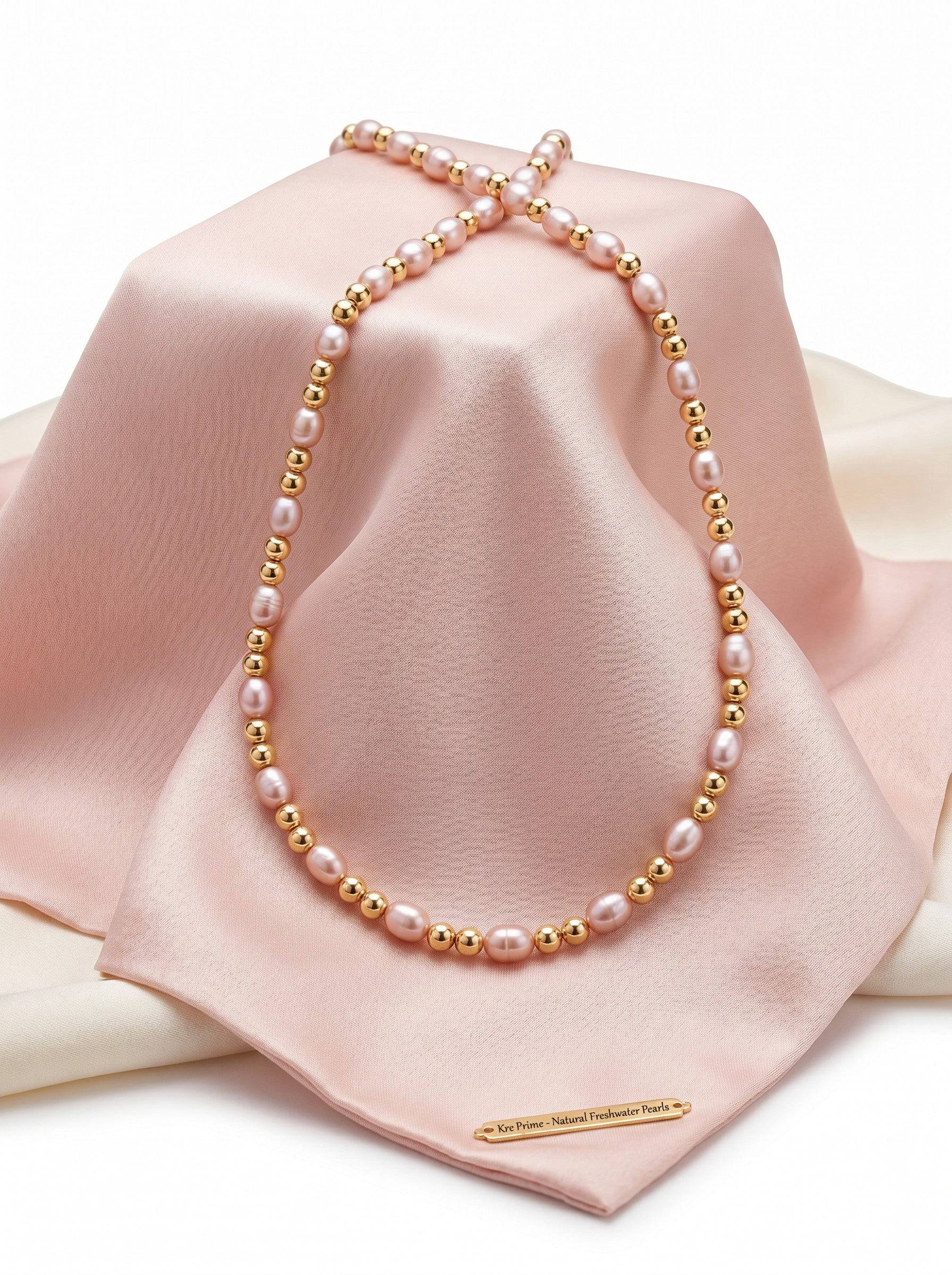 KRE PRIME Women's necklace with natural freshwater pearls and 14K gold beads. Features white/pink pearls and gold accents.