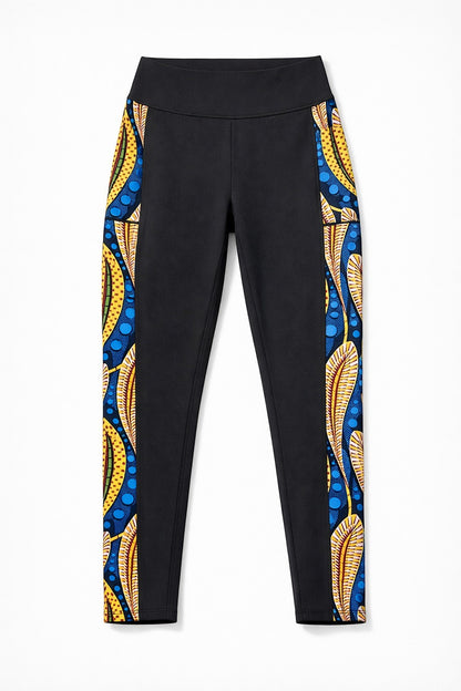 KRE Prime black leggings with side panel featuring a vibrant peacock feather print in yellow, blue, and red. Made from polyamide and spandex.