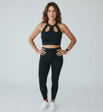KRE PRIME Women's dark grey ribbed crop top with cut-out neckline and halter straps. Made from polyester and elastane.