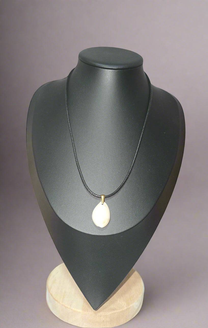 KRE PRIME handcrafted white shell pendant necklace on a black cord with gold-tone bail.