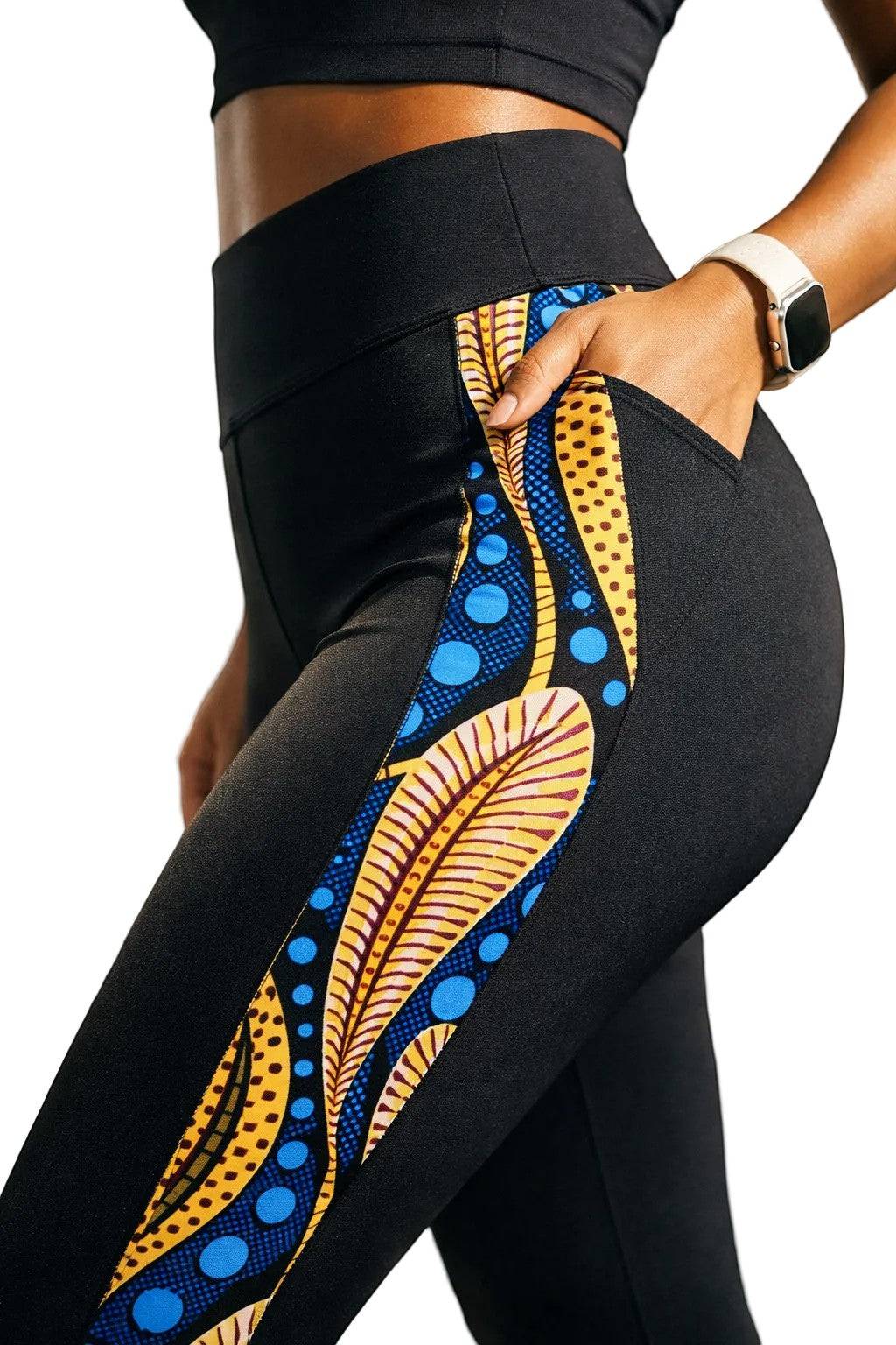 KRE PRIME women's activewear leggings in black with peacock print design and side pockets, made for comfortable activewear.