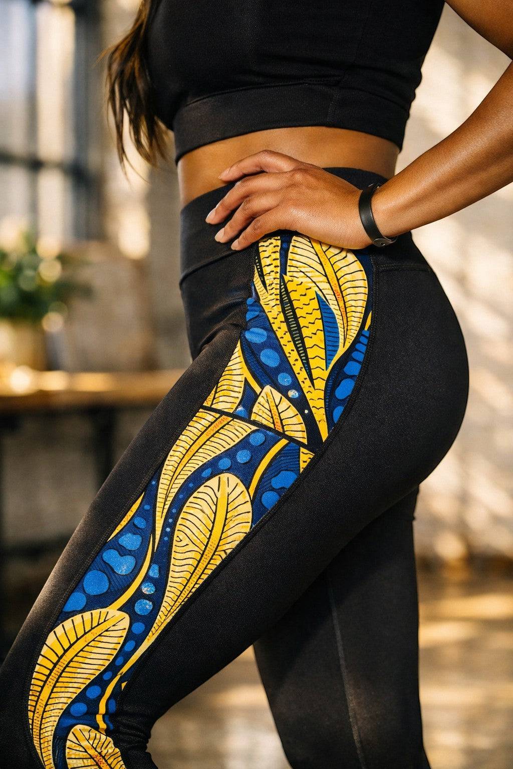 KRE PRIME women's activewear leggings in black with peacock print and side pockets, designed for comfortable exercise and casual wear.