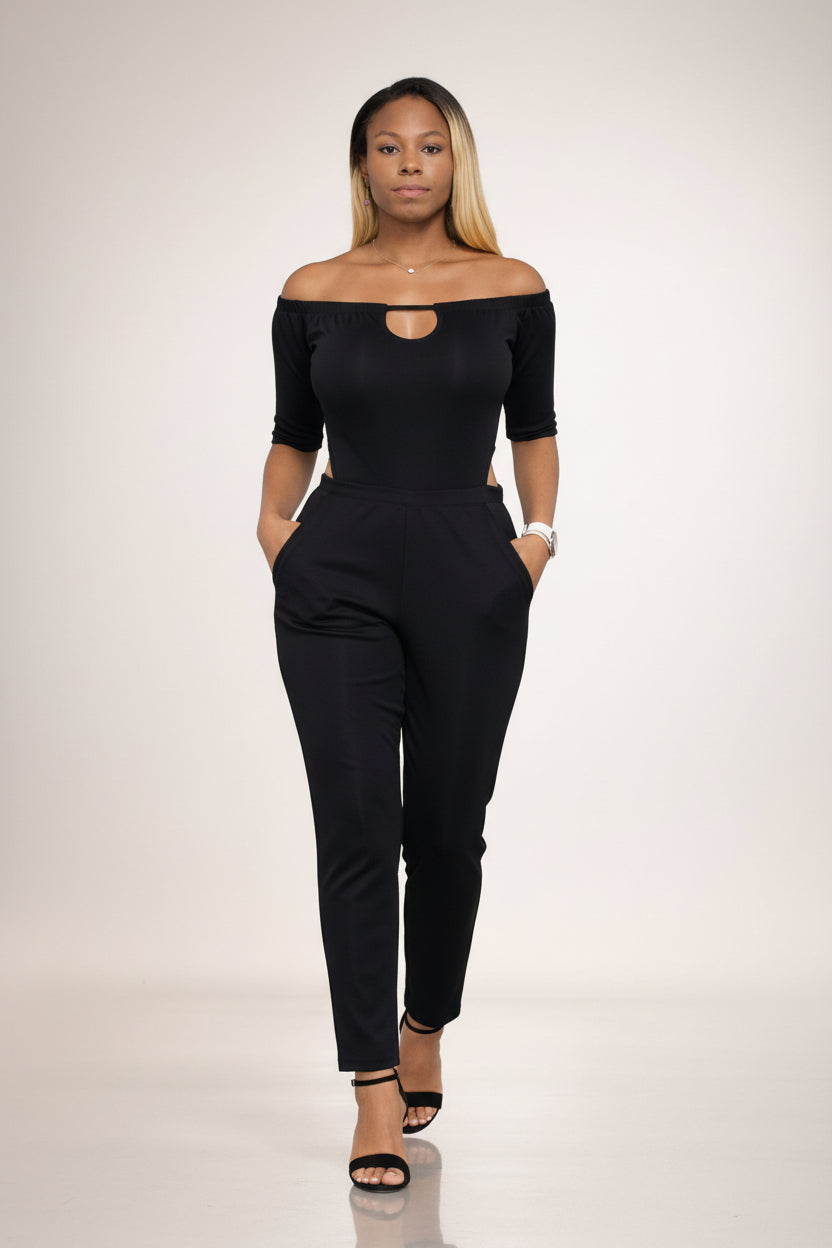 KRE Prime Women's black convertible jumpsuit with off-the-shoulder neckline and side pockets. Made of polyester-spandex blend.