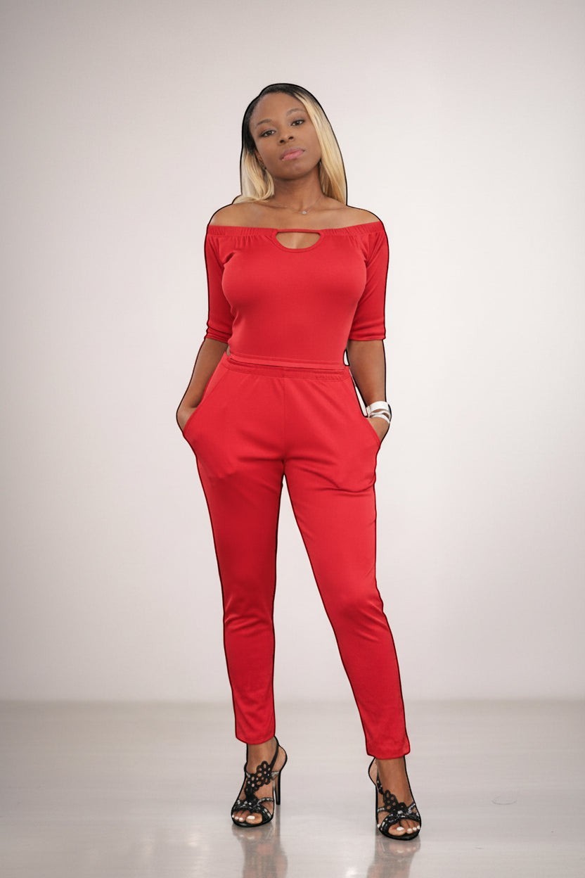 KRE Prime Women’s red convertible jumpsuit with off-the-shoulder neckline and pockets, made of stretch polyester-spandex blend.