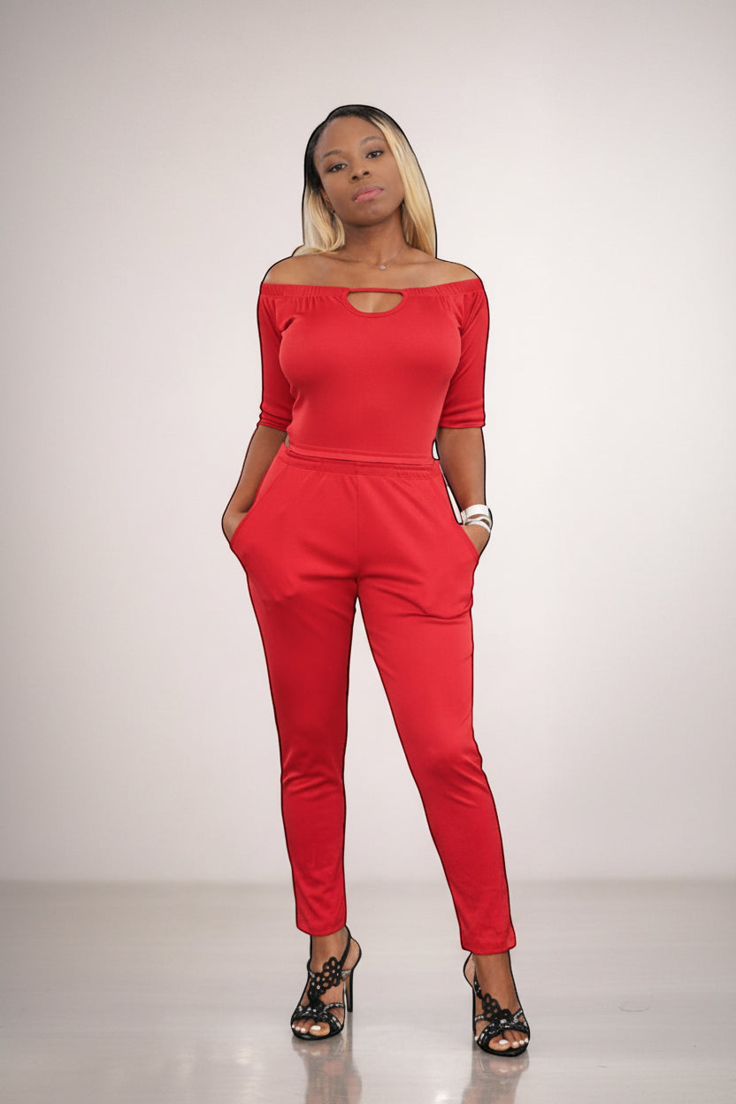 KRE Prime Women’s red convertible jumpsuit with off-the-shoulder neckline and pockets, made of stretch polyester-spandex blend.