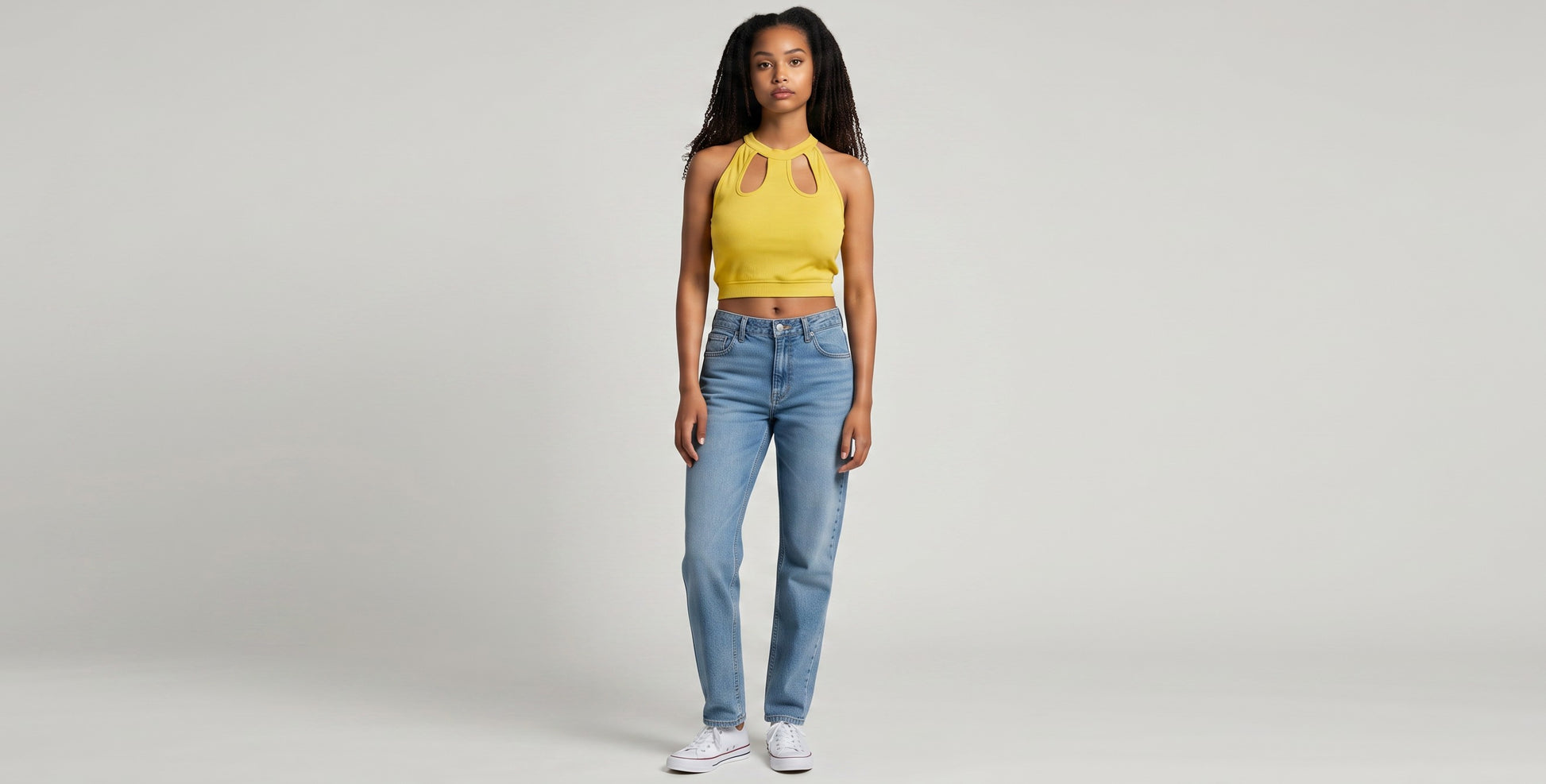 KRE PRIME yellow ribbed crop top with cut-out neckline and halter straps. Made from polyester and elastane.