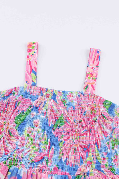 KRE PRIME women's floral smocked square neck jumpsuit with pockets, featuring a fitted waist and lightweight fabric for a stylish look.